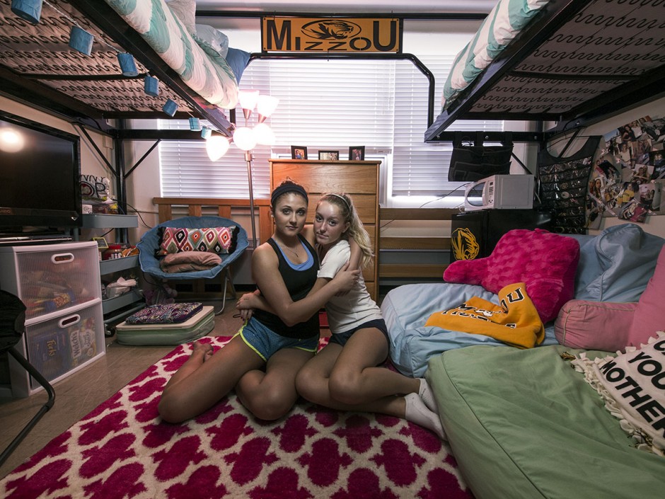Two girls hugging in their room