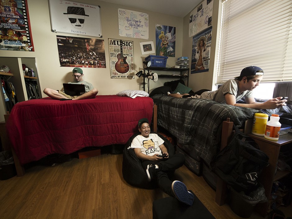 Three boys sitting in a room