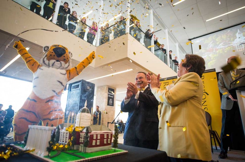 Truman, Chancellor Loftin and Cindy Mustard with cake and confetti.
