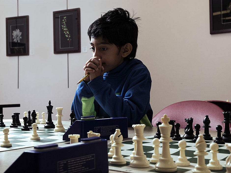 Saatvik Kannan, 8, waits for his chess opponent to make her move