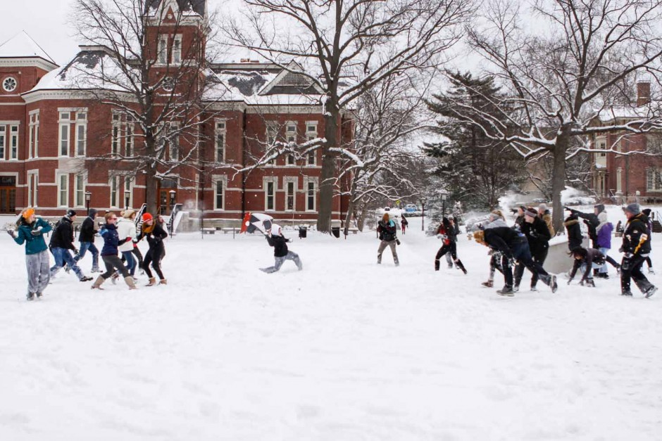 Students on the Quad took sides and began a snowball fight. The event went in spurts, depending on how fast each team could recreate snowballs. Photo by Tanzi Propst.