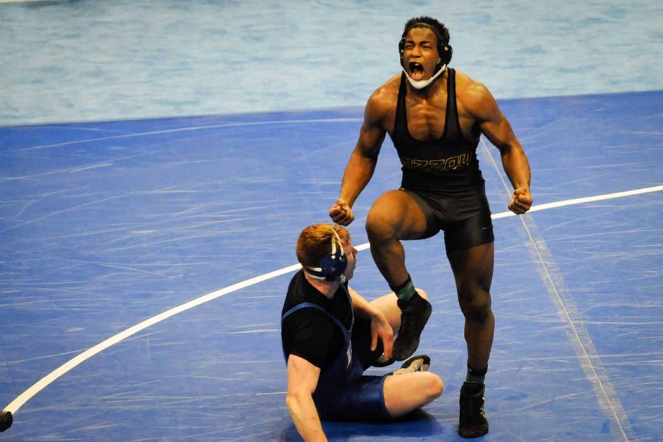 J'Den Cox faces Mizzou fans and celebrates a 4-2 win against Duke's Conner Hartmann for fifth place and All-American recognition in the 197 pound division.