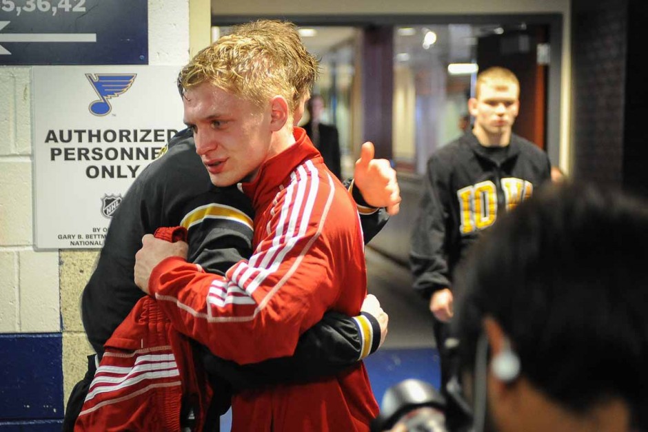 Drake Houdashelt hugs competitor David Habat (Edinboro) after their match for the national title where Houdashelt won in sudden victory for a 3-1 final score.