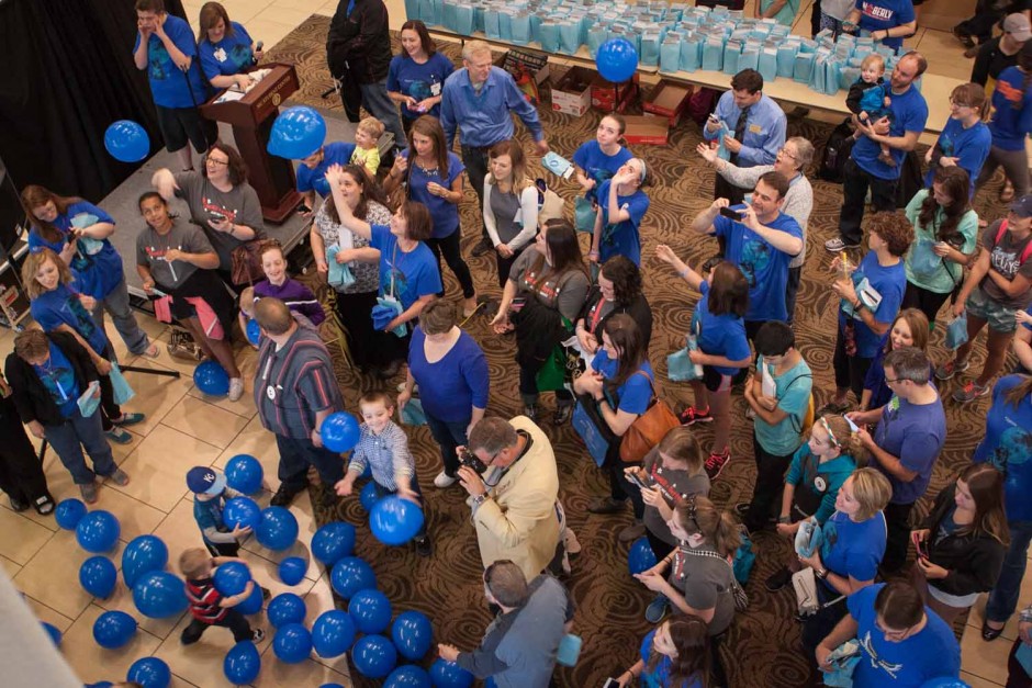 Blue balloons fall from the second floor of the Student Center. The balloons were released simultaneously with the ribbon cutting ceremony.