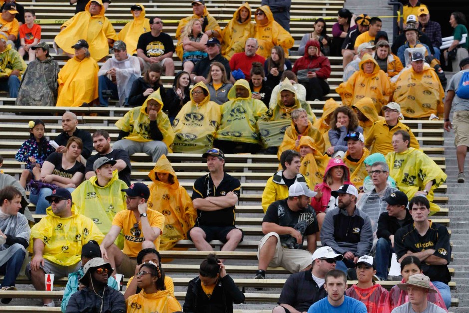 Fans in rain ponchos.