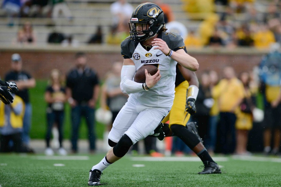 Maty Mauk runs the ball during the second half. All quarterbacks wore white during the game and could not be tackled.