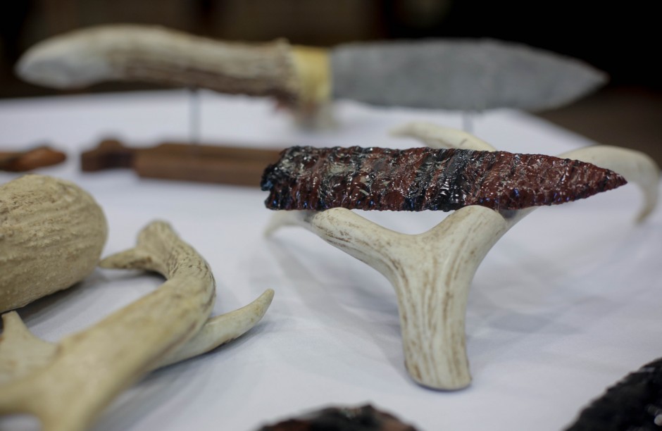 Handmade tools and weapons made by ____ from ____ stand on display at the 2015 MU Arts and Crafts showcase. ____ employs the process of Flintknapping, which is the use of percussion and pressure-flaking techniques to chip and shape stone to create his tools.