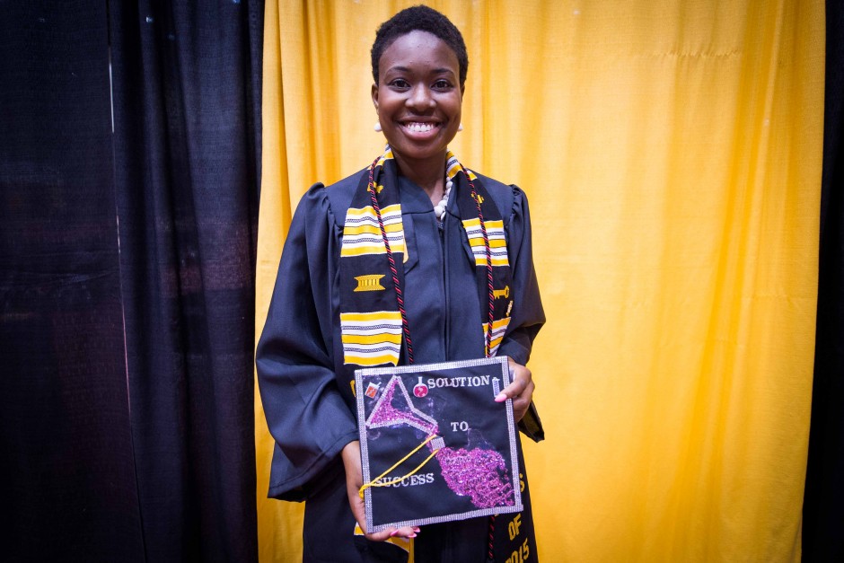 Maureen Tanner, a biochemistry major, shows off her solution to success mortarboard.