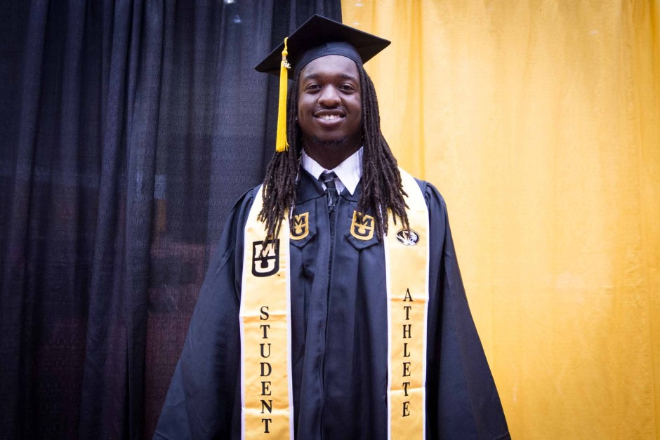 Clarence Green, a linebacker for the football team, shows off his student athlete regalia.