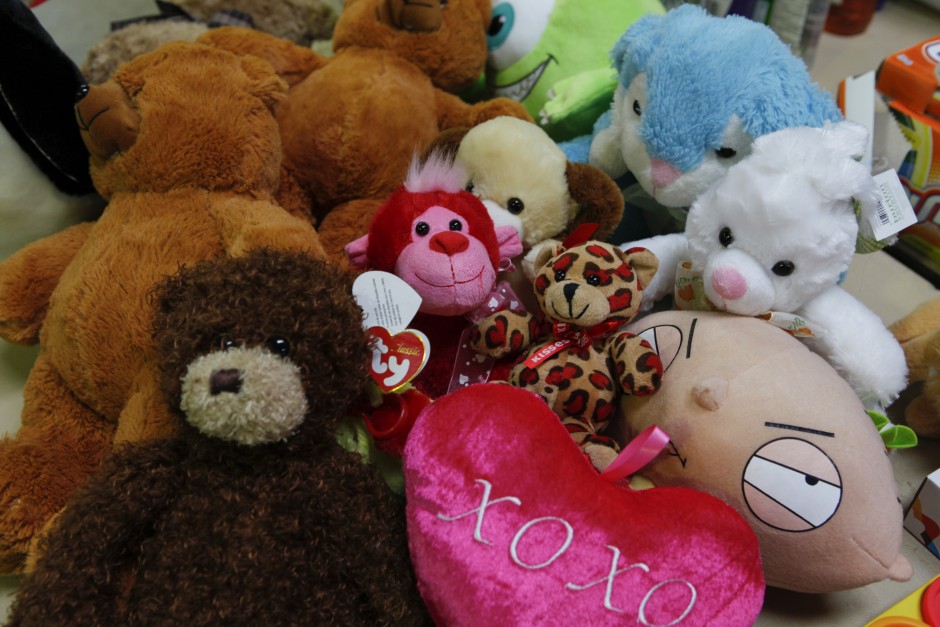 Various stuffed animals are piled on a table in Mizzou's surplus property's warehouse, ready to be sold at Tiger Treasures' Rummage Sale on Saturday, May 30, 2015.