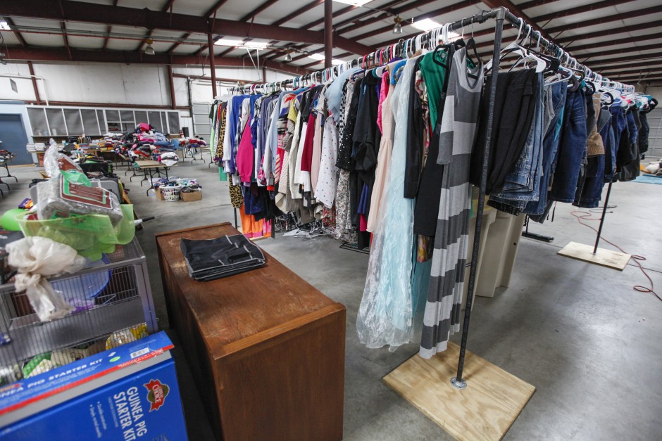 Jeans, an Elsa costume and various shirts hang from a clothing rack near stuffed animals and a table of reusable tote bags in Mizzou's Surplus Property's warehouse. "All the items are priced to sell," Julie Alexander, executive director for the University YMCA, said. "We don't want to price-gouge anyone. We're helping send kids to camp and keeping this stuff from going to a landfill. It's a win-win for everyone."