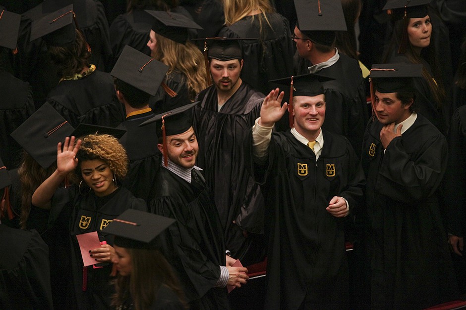  Before receiving their diplomas and becoming Mizzou alumni, School of Natural Resources students turn and wave to friends and family who have supported them while earning their degrees. Photo by Tanzi Propst.