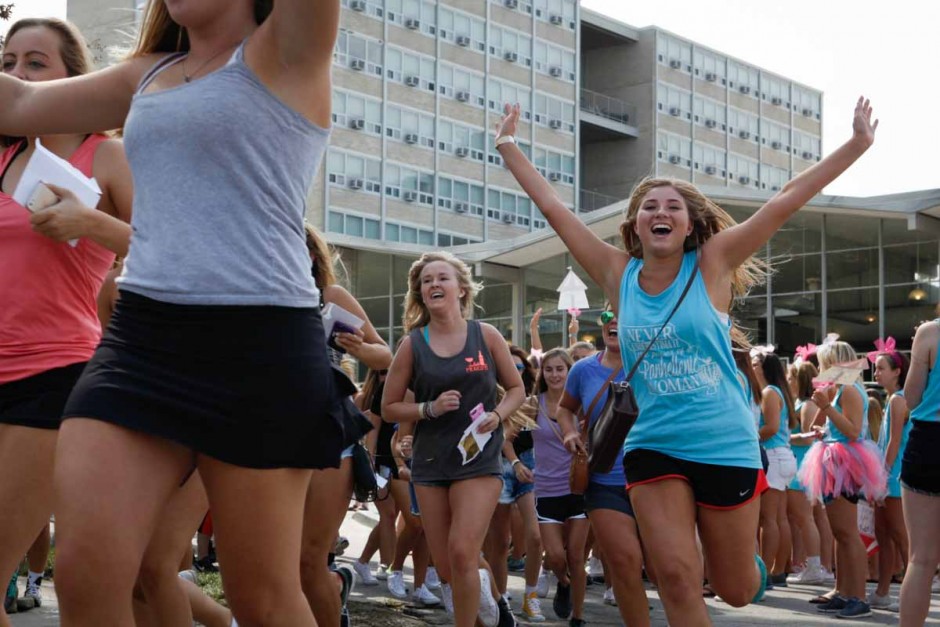 Freshman race into Greek town to meet up with their respective chapters after the Bid Day reveal on Faurot Field Sunday morning. Everyone was funnelled out of Faurot, under the tunnel and into Greektown, easing the flow of traffic.