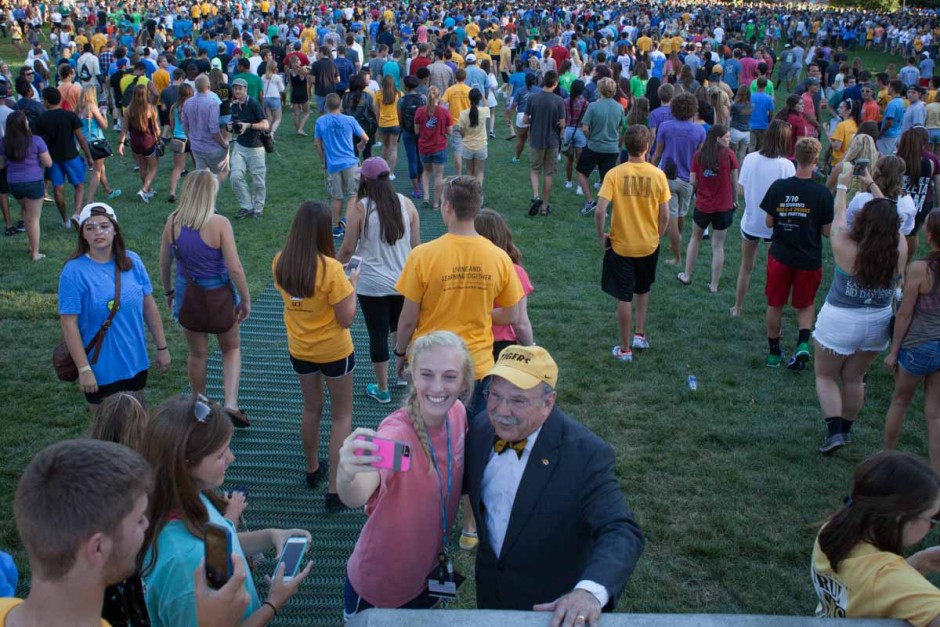 Many freshman had to stop for the infamous selfie with Chancellor Loftin before continuing on to receive free tiger stripe ice cream after the Tiger Walk Sunday evening. Once the first students raced through, the pace slowed considerably and gave others more time to spend chatting it up with Mr. Bow-Tieger. Photo by Tanzi Propst.