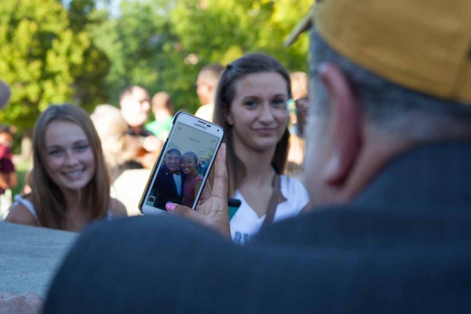 A freshman stops to take a selfie with Chancellor Loftin after passing through the columns during the Tiger Walk Sunday evening. While many students simply held their phone to take the photo, there were others who came prepared with selfie-sticks. Photo by Tanzi Propst.