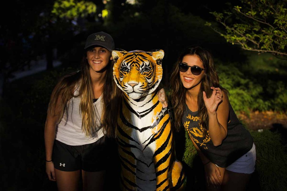 Freshman Jordan Alford and Sophomore Madeline Simer pose by a Tigers on the Prowl statue. Photo by Nic Benner.