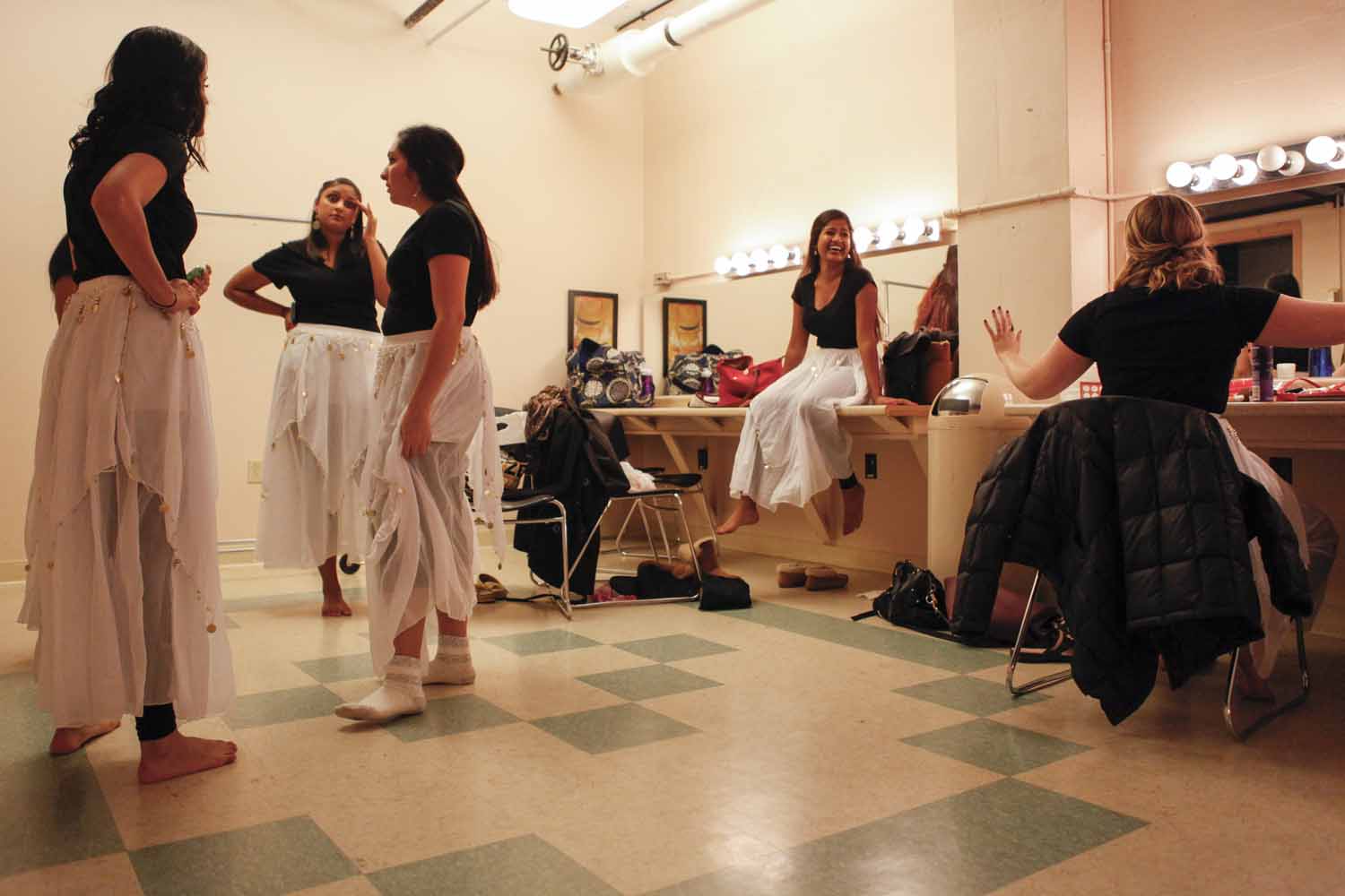 Members of Mizzou Masti converse with each other in the dressing room prior to their performance in India Nite at Jesse Hall.