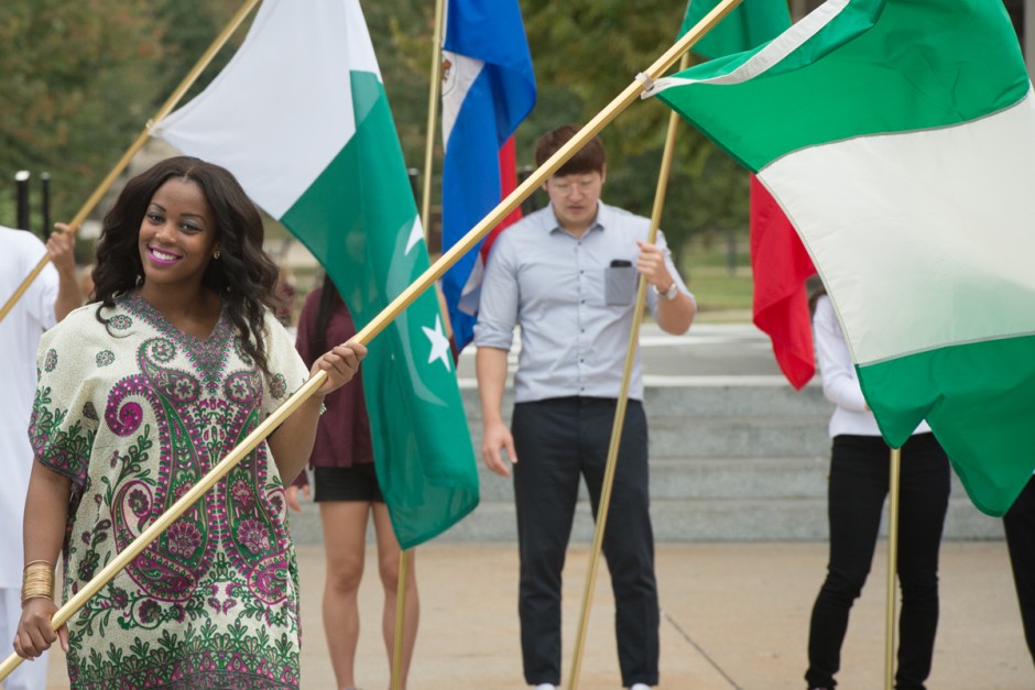 Nigerian student carrying flag.