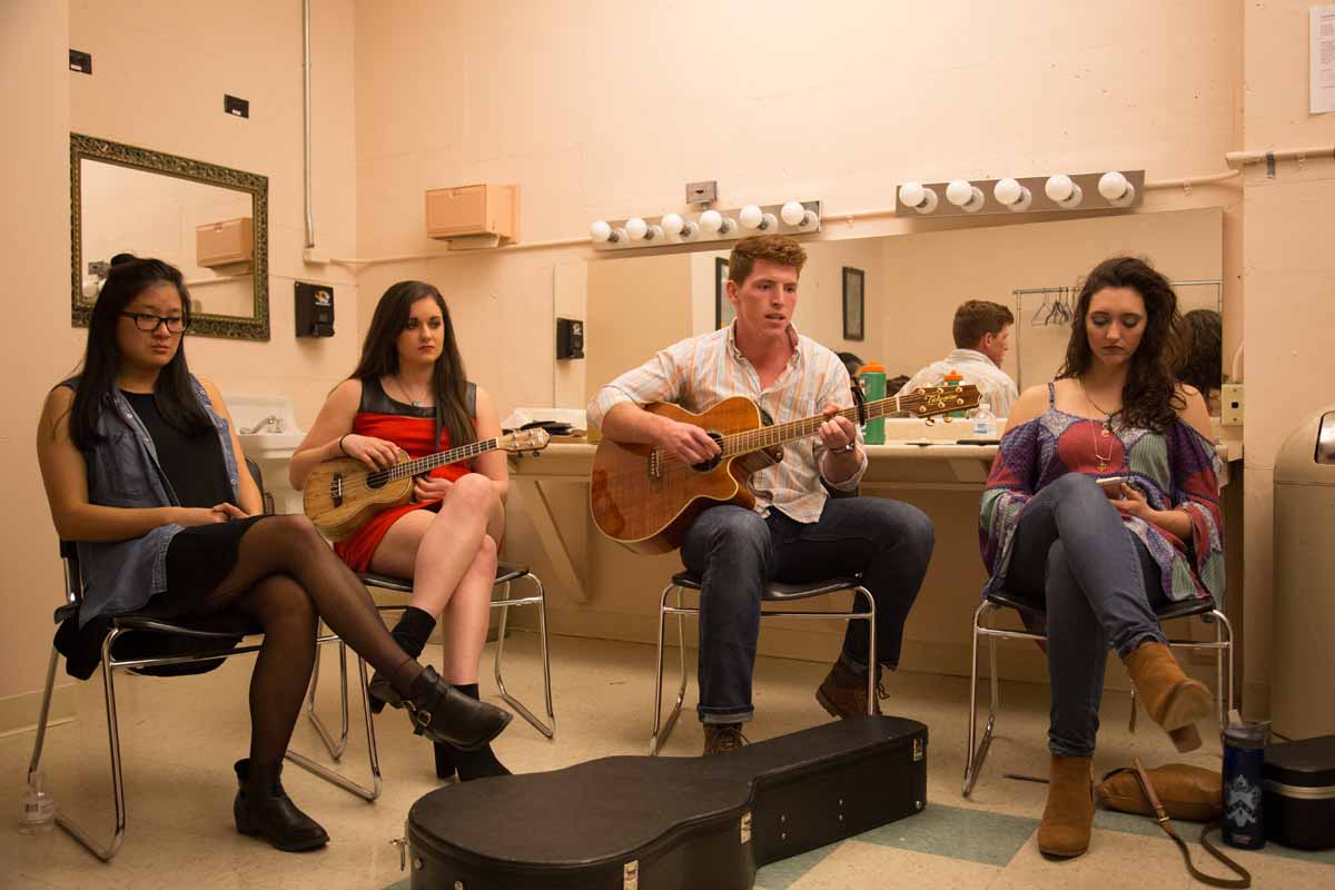 All of the different contestants have different ways of preparing from the show, from collecting their thoughts in silence to playing a bit of guitar to relieve the tension in the room. Photo by Jake Hamilton.