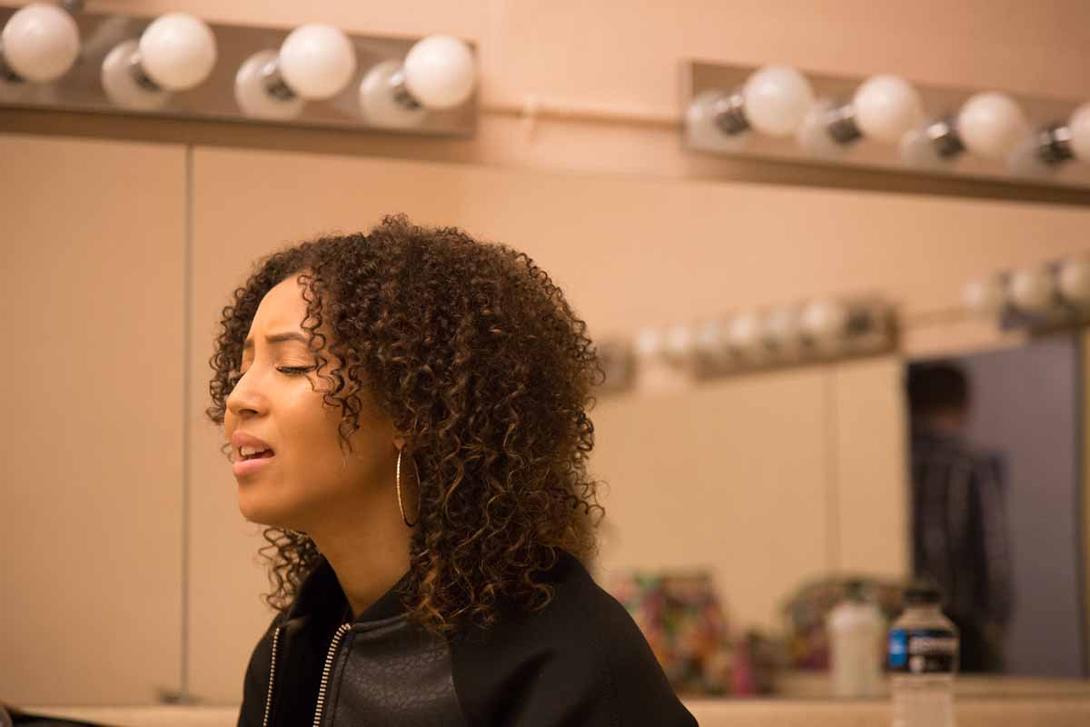 Mizzou Idol contestant Jhaere Mitchell practices her lines in the dressing room before taking the stage. Photo by Jake Hamilton.