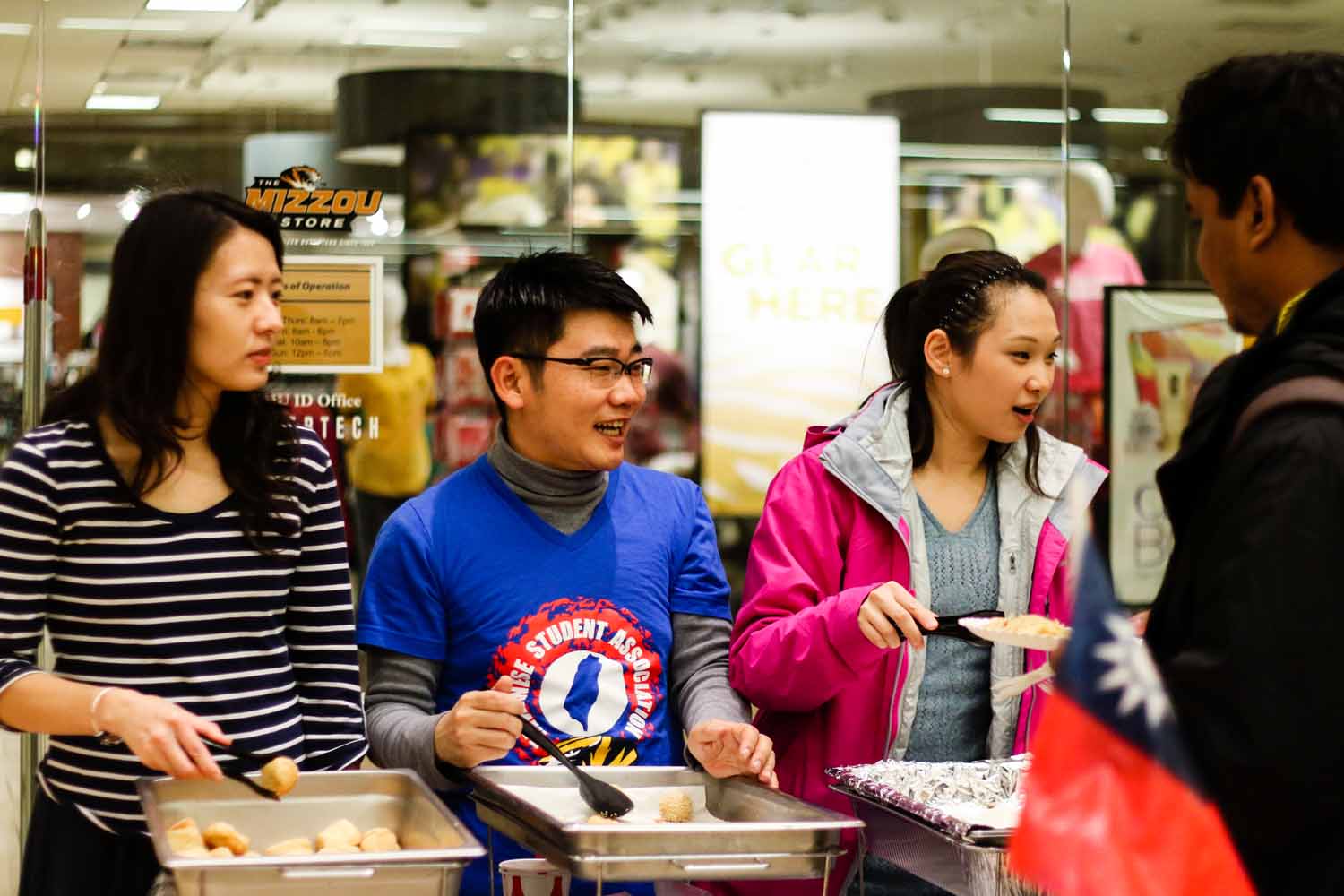 Members of the Vietnamese Student Association serve traditional foods to guests of the International Welcome Party. Photo by Hanna Yowell.