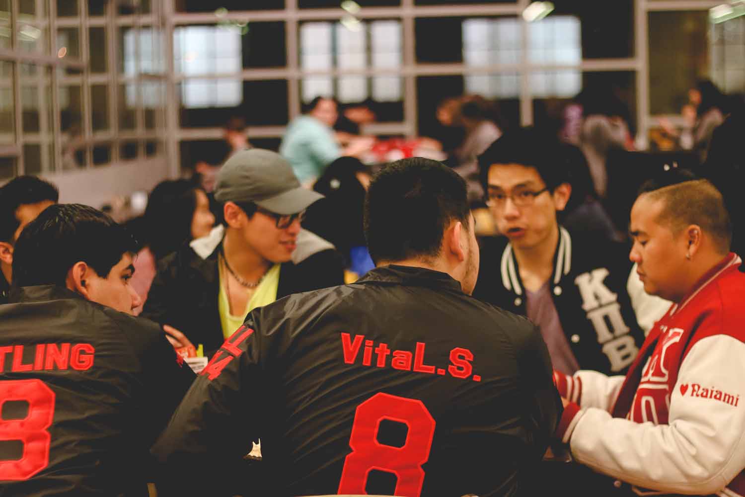 Members of Kappa Pi Beta, an Asian American-founded service and social fraternity on campus, share a meal at the welcome party. Photo by Hanna Yowell.