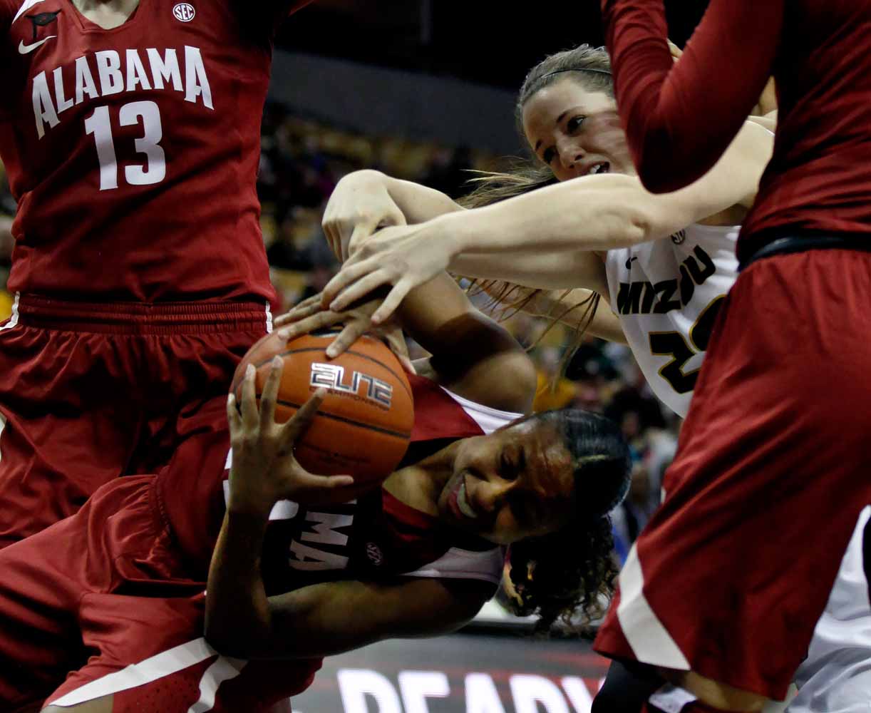 Alabama's sophomore guard Karyla Middlebrook (22) tries to steal the ball away from Missouri's redshirt sophomore forward Kayla McDowell (20) during the second half of the game Thursday evening, Feb. 11, 2016 at Mizzou Arena.