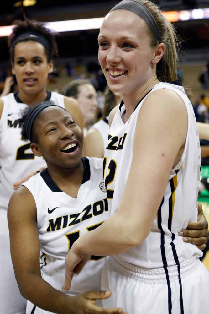 Carrie Shephard (15) hugs Michelle Hudyn (12) as they head off the court and into the locker room following the Tigers' 63-52 win over Alabama Thursday evening, Feb. 11, 2016.