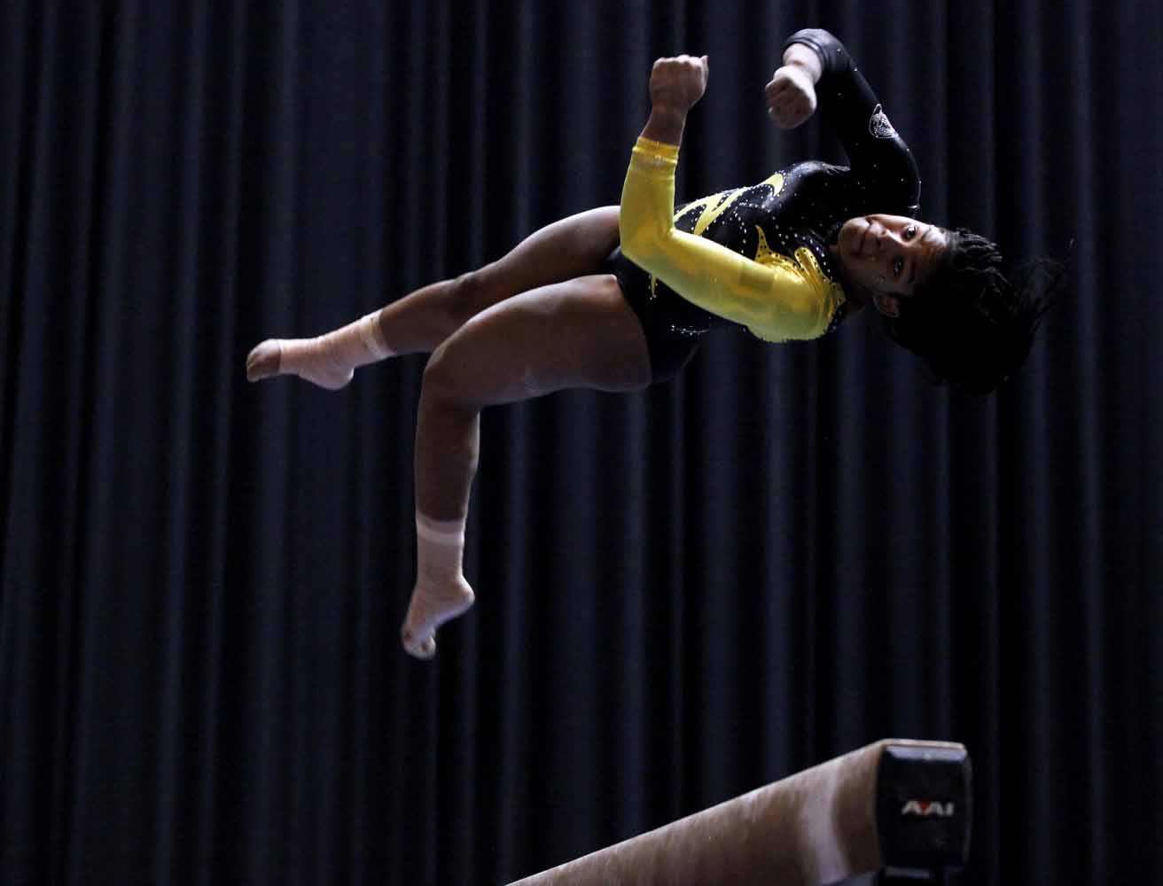 Mizzou sophomore Tia Allbritten jumps and twists during her performance on the balance beam Friday evening, Feb. 19, 2016 during the gymnastics competition against the University of Florida.