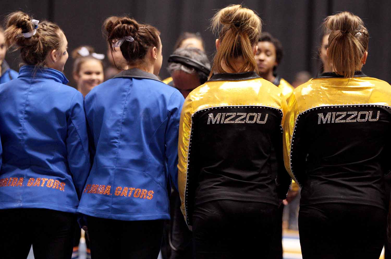 University of Florida gymnastics team members stand in a circle with University of Missouri gymnastics team members following the announcement of awards Friday evening, Feb. 19, 2016 at the Hearnes Center.