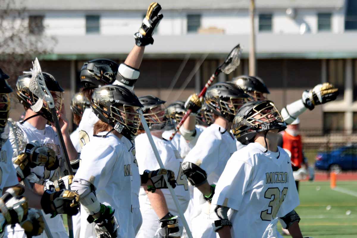 The Mizzou men's lacrosse team cheers from the sideline of Stankowski Field after scoring another point against Oklahoma State University Sunday, Feb. 21, 2016.