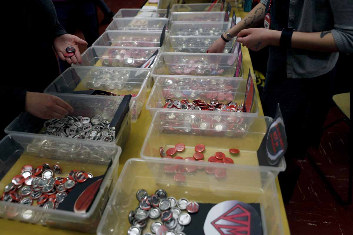 Buttons reading "Happy VDay" and other tokens about the vagina are sold in the lobby of Jesse Hall to raise money and awareness Saturday evening, Feb. 27, 2016.