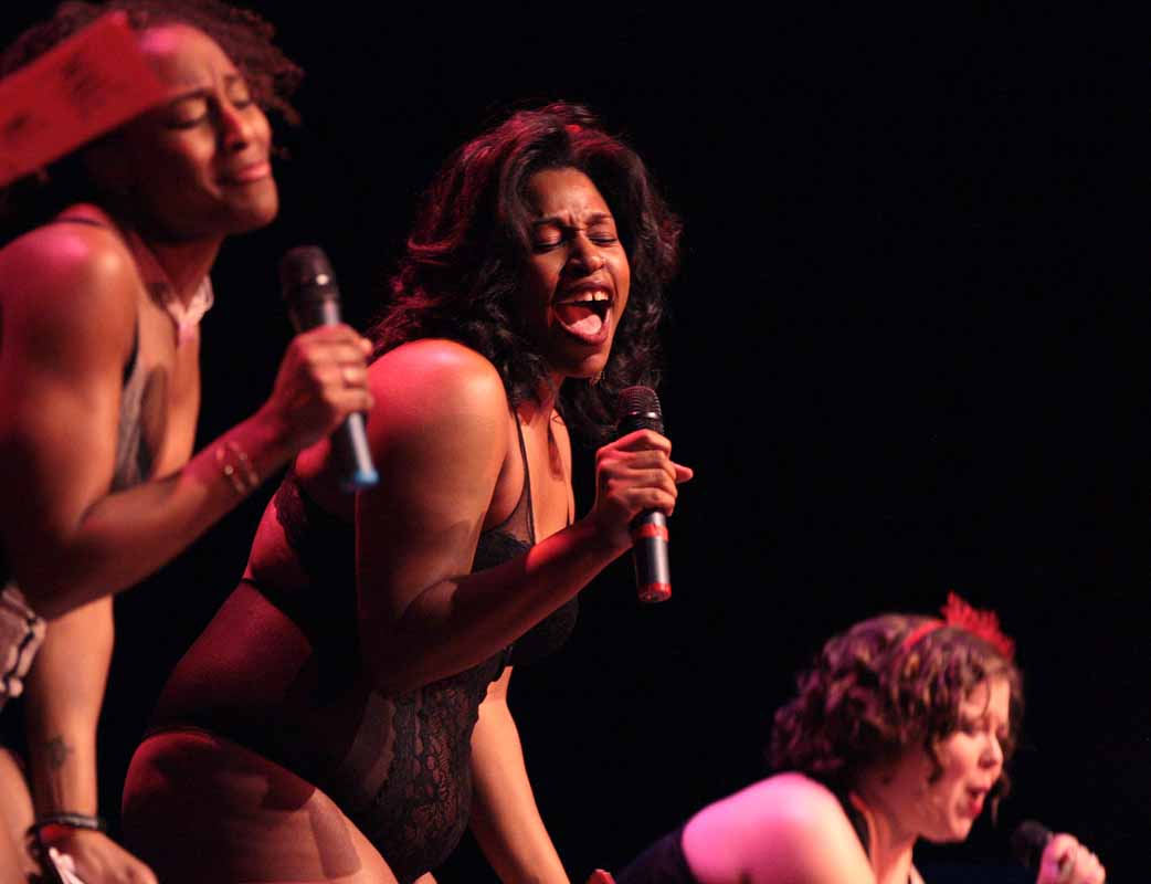 India Gibbs, middle, moans during her performance in "The Woman Who Loved To Make Vaginas Happy" in the Vagina Monologues Saturday evening, Feb. 27, 2016 in Jesse Auditorium.