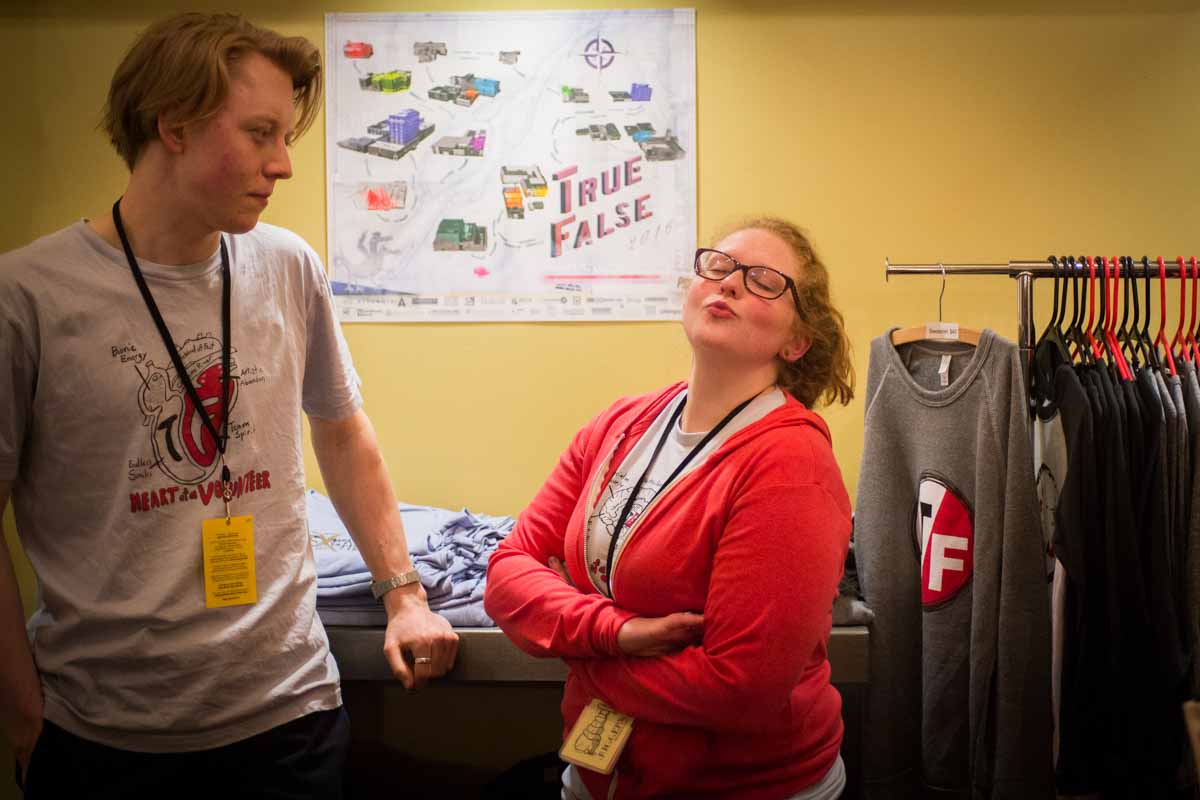 Katie Elfer, one of a 1,000 True False volunteers, blows a kiss to the camera while selling swag to festival goers. Photo by Shane Epping.