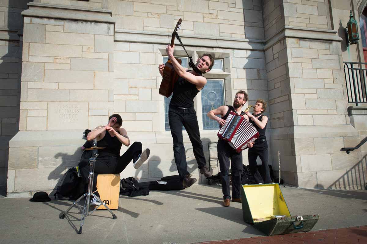 Back by popular demand, French tricksters Les Trois Coups perform on 9th Street in front of the United Methodist Church. With a quick witted, quick moving charm and musicality they bound around spaces- into ears and hearts- with the wild abandon of a gypsy night. Photo by Shane Epping.