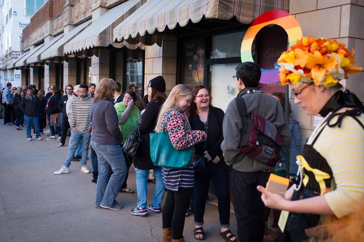 Movie goers wait in line at the Q in front of the Missouri Theater in hopes of attending the next film if room allows. Photo by Shane Epping.