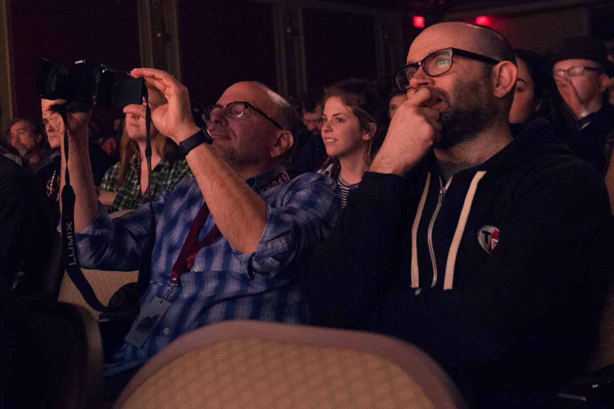 Stacey Woelfel and Robert Greene sit in the second row at the Missouri Theatre as directors Adam Dietrich, Kellan Marvin, and Varun Bajaj address the auditorium about their film #ConcernedStudent1950 Saturday evening. Photo by Tanzi Propst.