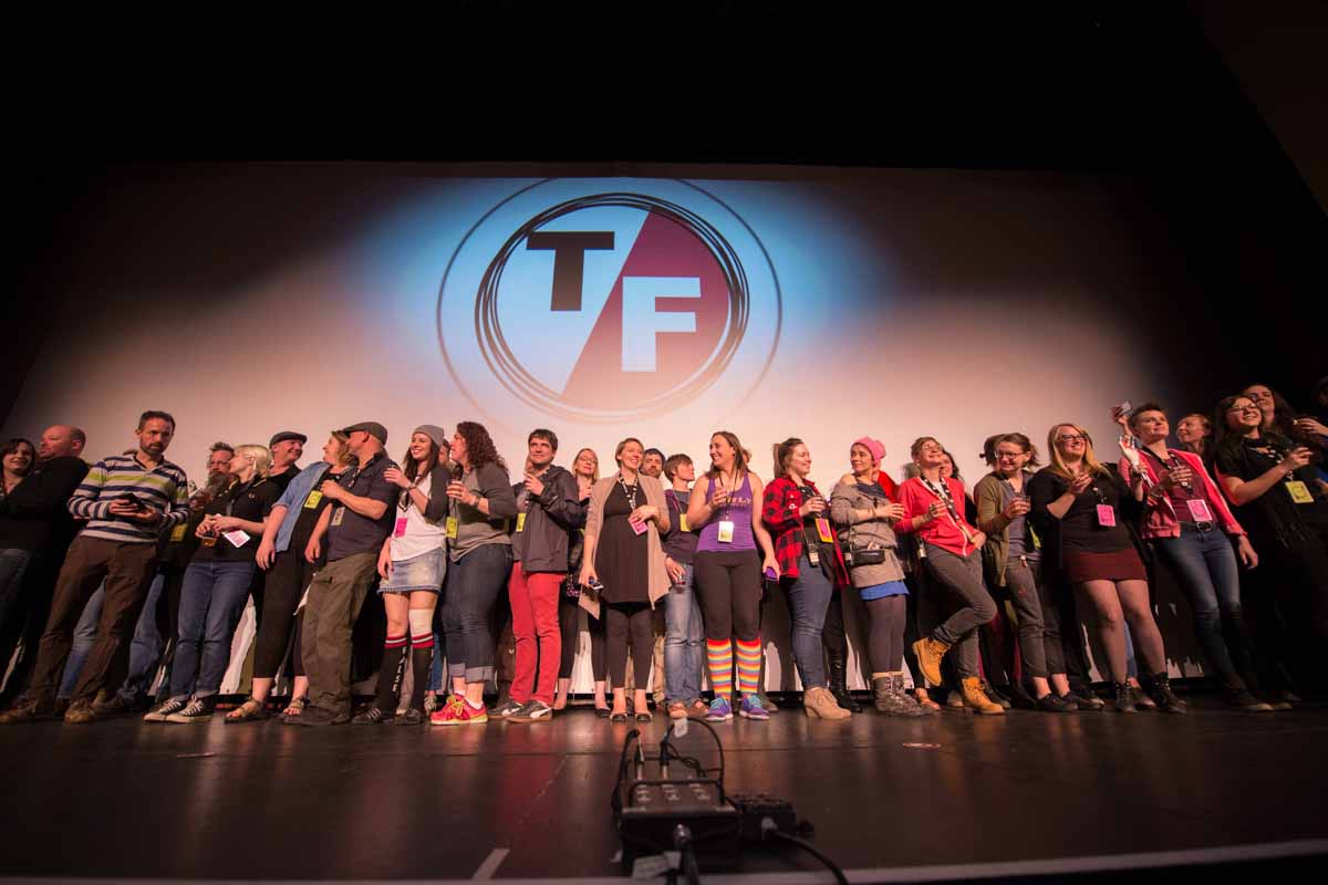 The core volunteers of the True False Film Festival take the Missouri Theatre stage for a standing ovation near the end of the festival. Photo by Shane Epping,