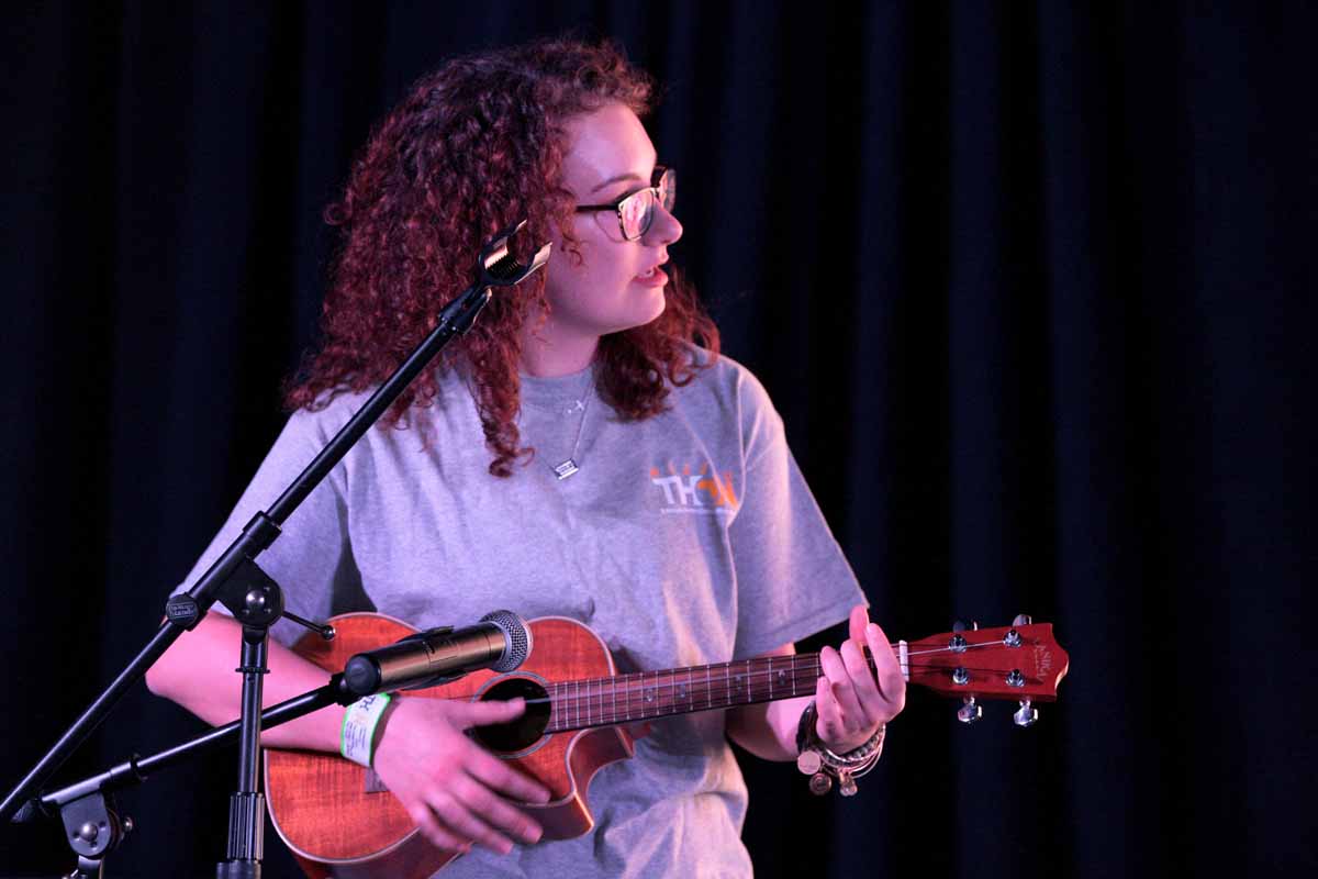 Senior Kat Birkenbeuel, MizzouThon leadership member, plays the ukulele on stage during a tribute video to Miracle Child Tommy who passed away in November 2015. "Tommy was the first nonverbal kid I met," Birkenbeuel said. "As soon as I started talking to him I saw his eyes light up. In that moment, I really understood that just because you can’t talk doesn’t mean you can’t communicate. His laugh was amazing."