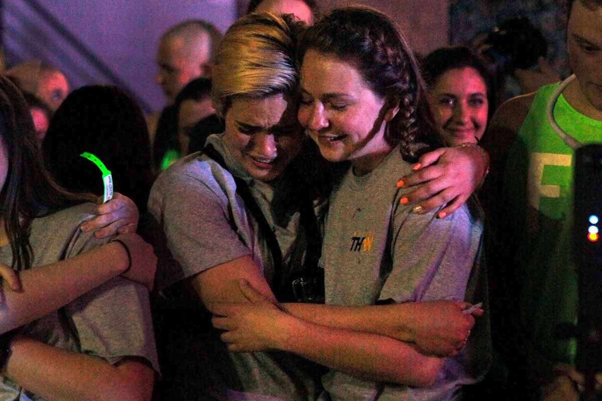 Senior Ellen Hinze cries, hugging senior Erin Ehlers as Miracle Families make the rounds to cut off the wristbands of each dancer at the end of MizzouThon. "Ellen, you're crying because it's over and I'm smiling because it happened," Ehlers said.