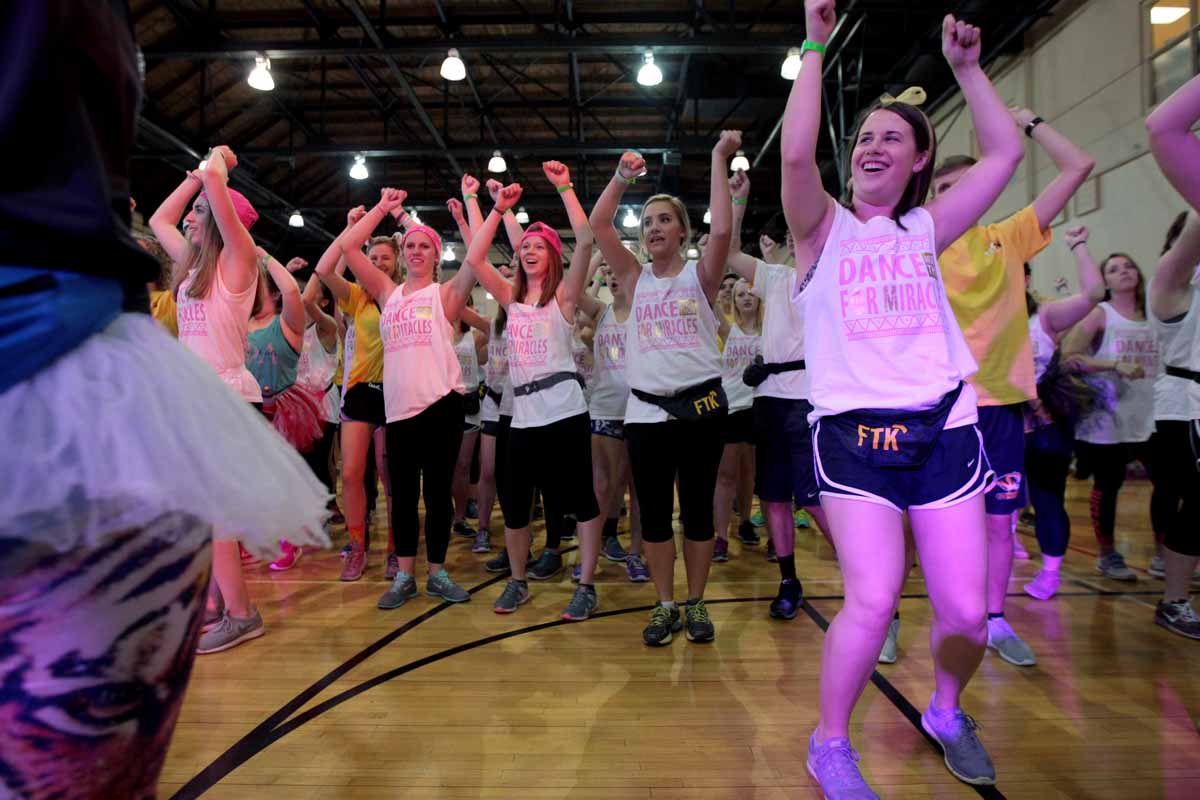 Sisters of Phi Mu dance it out in the front row while learning the next 8-count of the morale dance. The sorority had special shirts made to show their connection to each other and the main event.