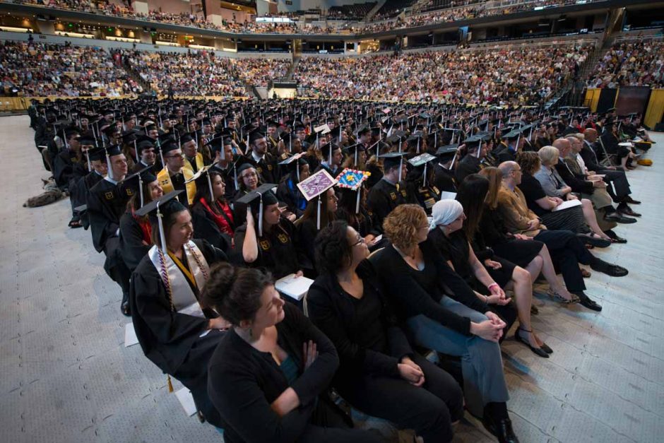 Students attend commencement ceremonies for the College of Arts & Sciences at Mizzou Arena on Saturday night. Photo by Shane Epping.
