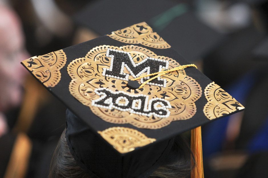 University of Missouri graduation ceremonies are marked with a cap and gown message during Honors Convocation Saturday. Photo by Rob Hill