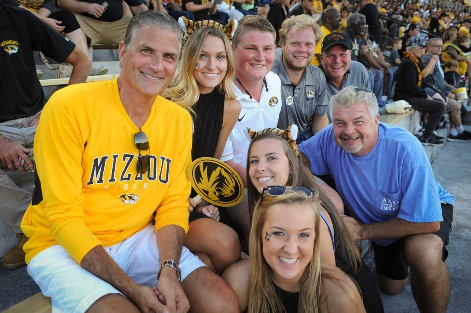 Members of the Pawelski and Giroux families enjoy watching the game from their seats on the east side of Memorial Stadium.