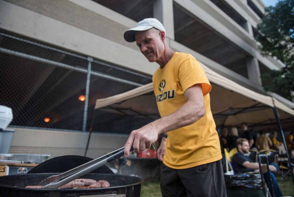 Craig Dulle, MU Alum '83, cooks up a late lunch during his tailgate party. He usually has 50-60 attendees.