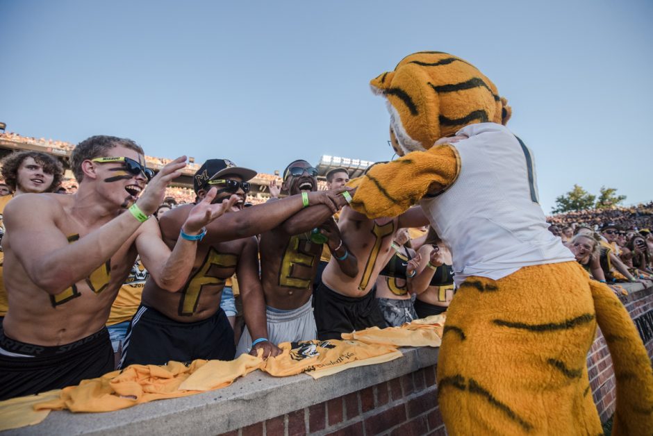 Truman The Tiger embraces some of his biggest fans in the Tiger Lair student section on Saturday.