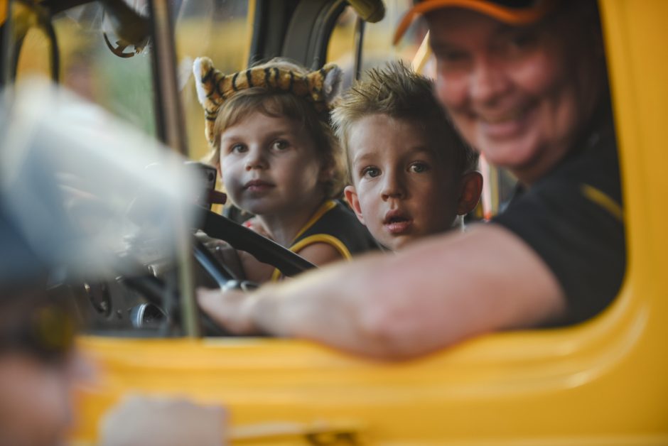 Kids in yellow truck.