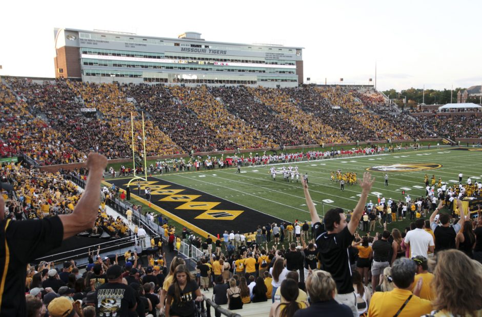 Memorial Stadium with fans in black and gold.