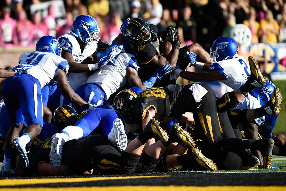 Running back Damarea Crockett rushes for two yards and scores a touchdown to put Mizzou ahead, 28-27. Photo by Shane Epping.
