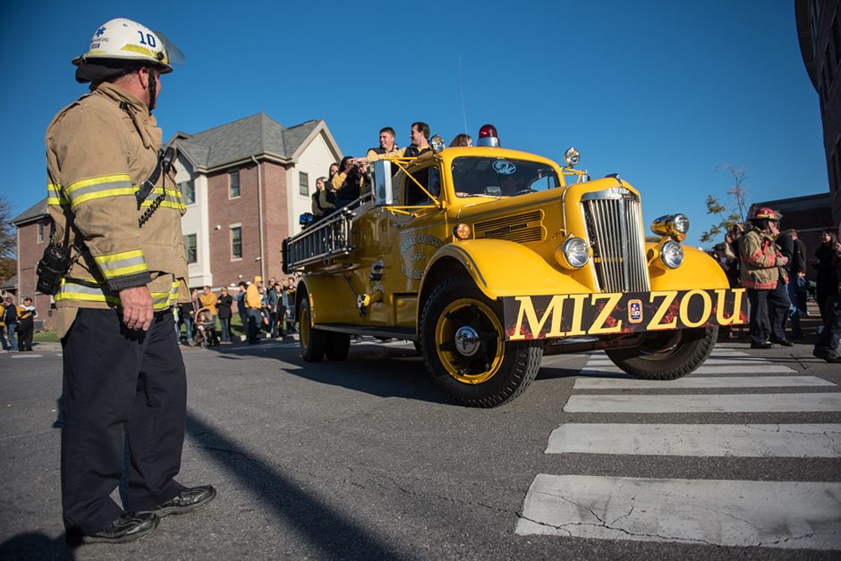 Mizzou Homecoming Steering Committee rode the old yellow fire truck in the parade. 